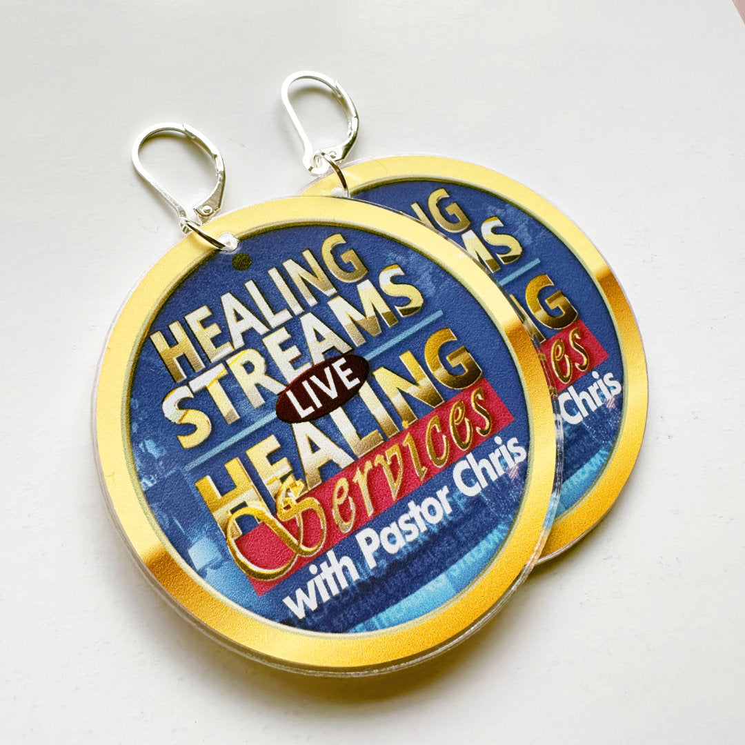 A pair of sliver lever-clasp earrings with the Healing Streams logo and a gold border on a white background.