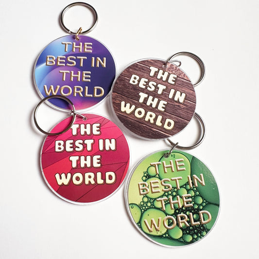 Four circular designs with 'The Best in the World' text different backgrounds